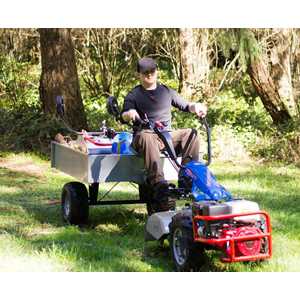 The Curved Coupler can be used to connect the Utility Trailer while the Rear-Tine Tiller is still installed.