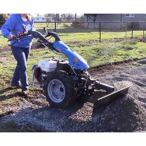 The 3/8" thick steel blade is great for pushing gravel, sand, soil, etc.