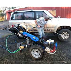 A handy caster wheel keeps the tractor level and makes the Pressure Washer easy to drive around the property.