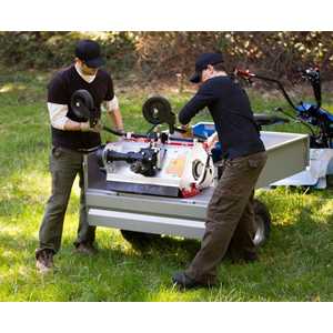 The swing-down tailgate makes it easy to unload heavy items like this Flail Mower attachment.